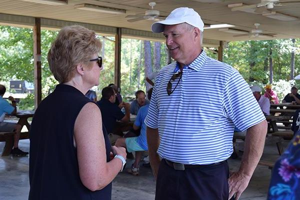 Dr. Chapman in conversation at golf classic